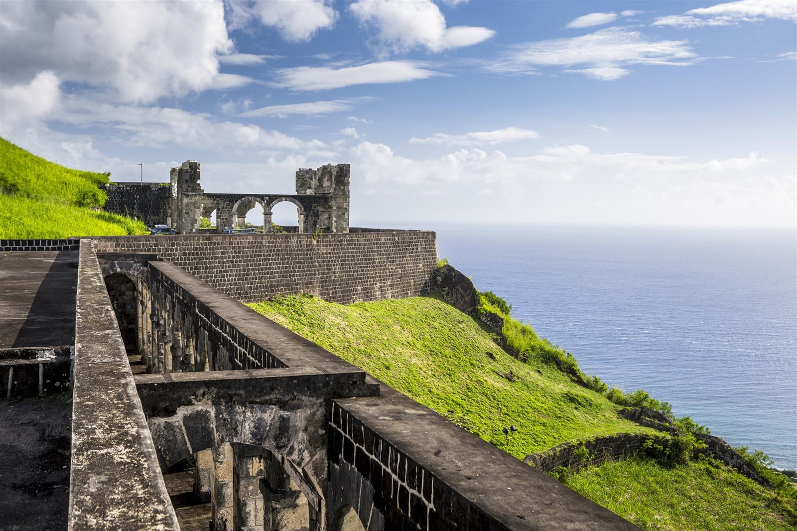 Stone walls of Brimstone Hill Fortress on St. Kitts overlooking the sea